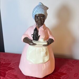 Pink Lady Ceramic Cookie Jar with Cream Apron and Headscarf.